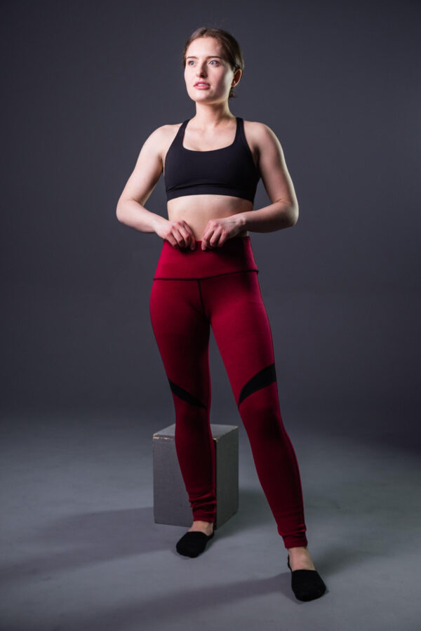 A white woman is modeling wearing Red Compression Yoga Pants
